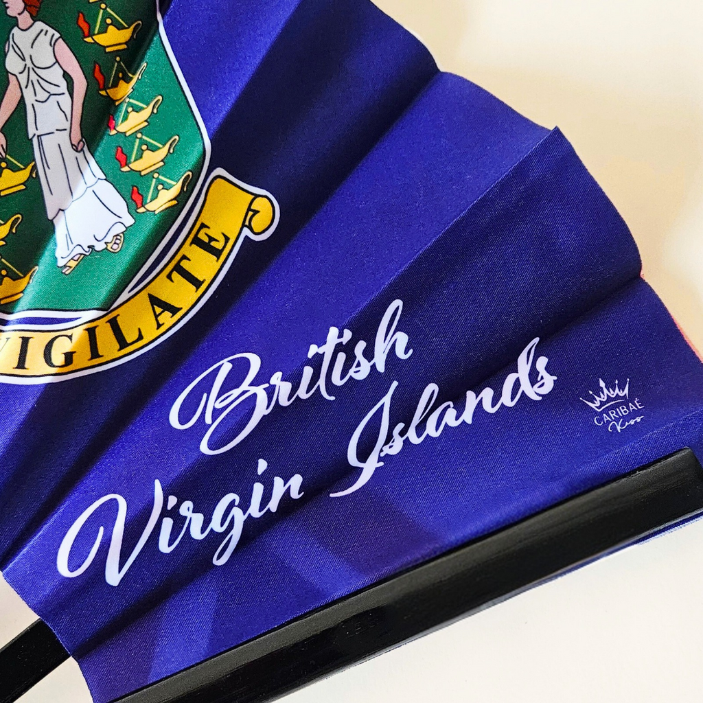 Close up of British Virgin Islands flag inspired bamboo folding hand fan displaying the country's name in script font and displaying the Caribae Kiss logo.