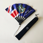British Virgin Islands flag inspired bamboo folding hand fan halfway open along with black suede satchel bag with Caribae Kiss white logo print.
