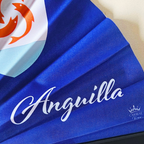 Close up of Anguilla flag inspired bamboo folding hand fan displaying the country's name in script font and displaying the Caribae Kiss logo.