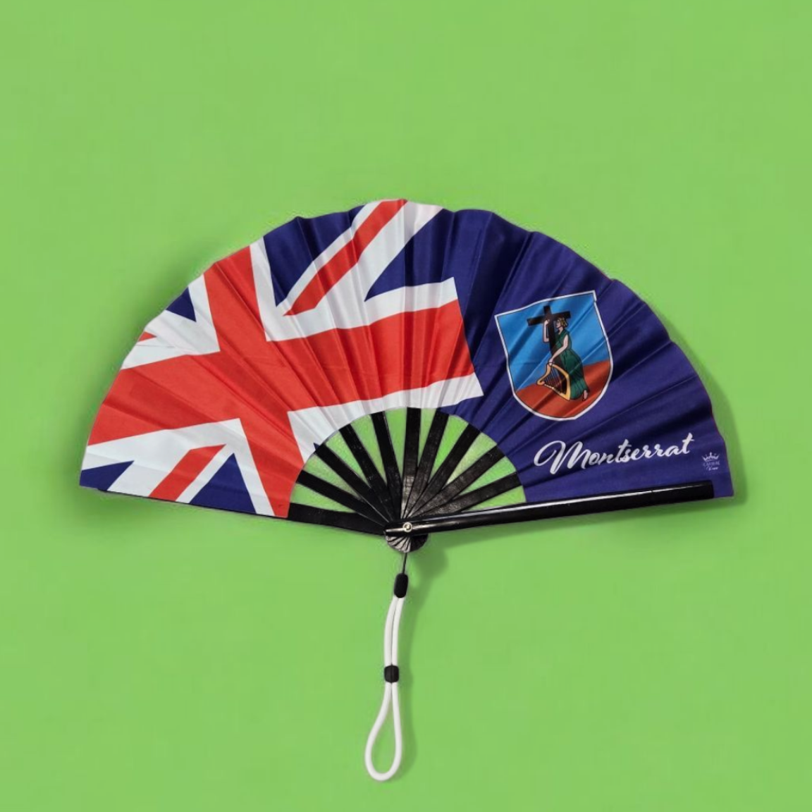 Montserrat folding hand fan featuring the Montserrat flag and tassel – cultural accessory by Caribae Kiss for St. Patrick’s Festival and island pride