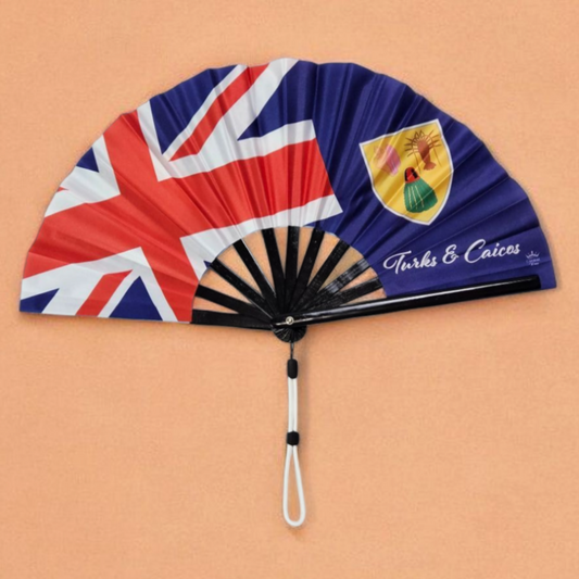 Turks & Caicos folding hand fan featuring the TCI flag and wristlet tassel – elegant accessory by Caribae Kiss for island events and Caribbean pride